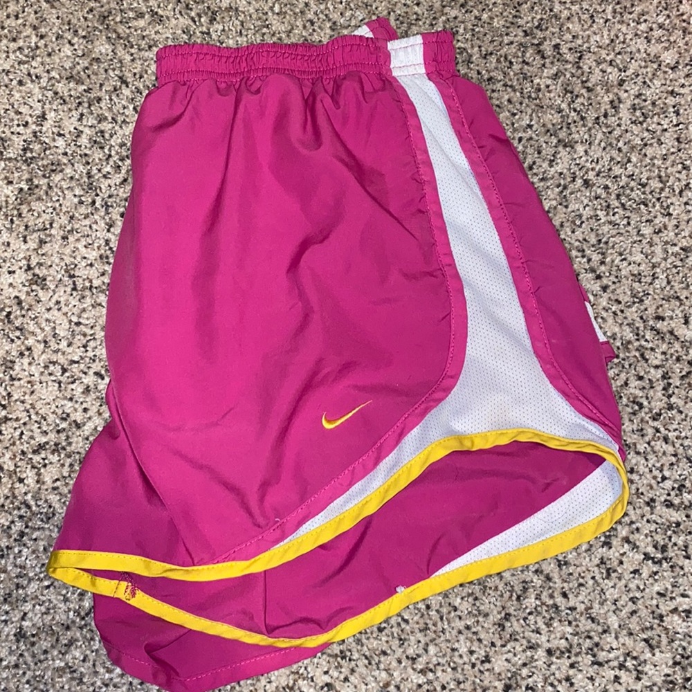 Pink with yellow striped Nike running shorts